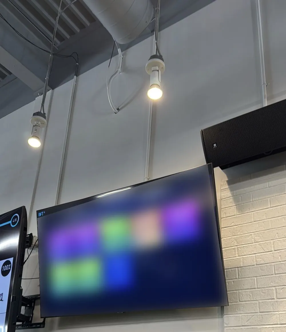 Wall-mounted television in a commercial fitness environment